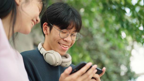 istock Teenager relaxing with smartphone together. 2037800583