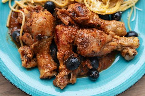 Italian chicken Cacciatore hunter's stew with spaghetti noodles