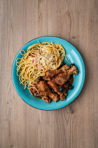 Italian chicken Cacciatore hunter's stew with spaghetti noodles