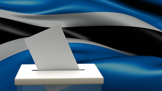 Blank ballot with space for text or logo is dropped into the ballot box against the background of the flag of Botswana. Election concept. 3D rendering. Mock up