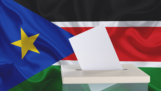 Blank ballot with space for text or logo is dropped into the ballot box against the background of the flag of South Sudan. Election concept. 3D rendering. Mock up