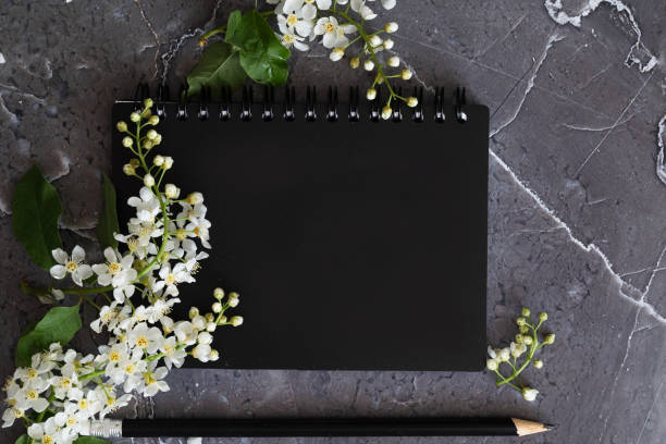 Blank  notebook on wood background.