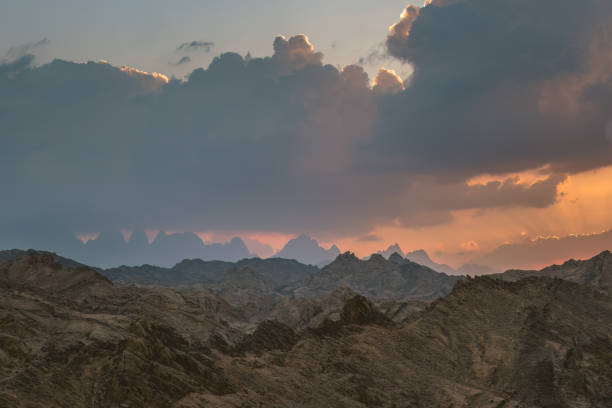 Dramatic Sunset over Red Sea Hills mountain chain and Sahara desert. Sun already behind horizon line, close up photo. Hurghada, Egypt