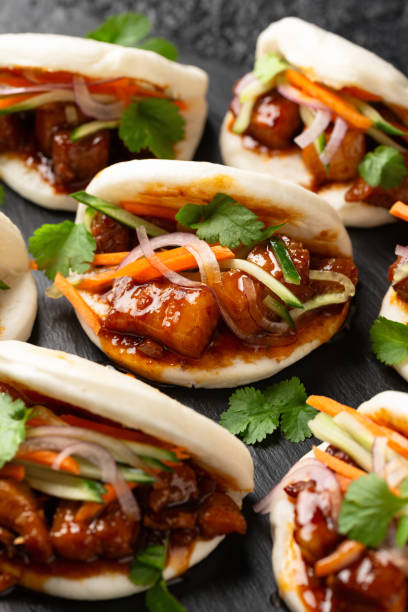 Bao buns with pork belly and vegetable. Asian cuisine
