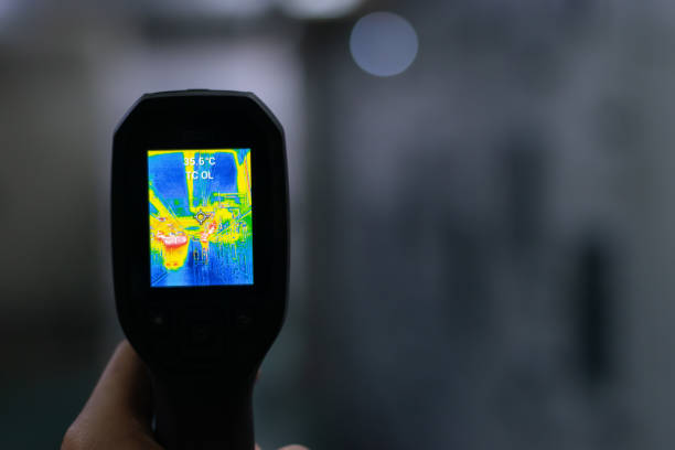 istock Professional Electrician use thermal infrared camera or thermometer scanning electrical system for preventive maintenance,Industrial thermography,Thermal image of power electric. 2037845294