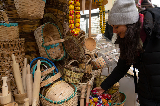 an artisan making a basket in the image