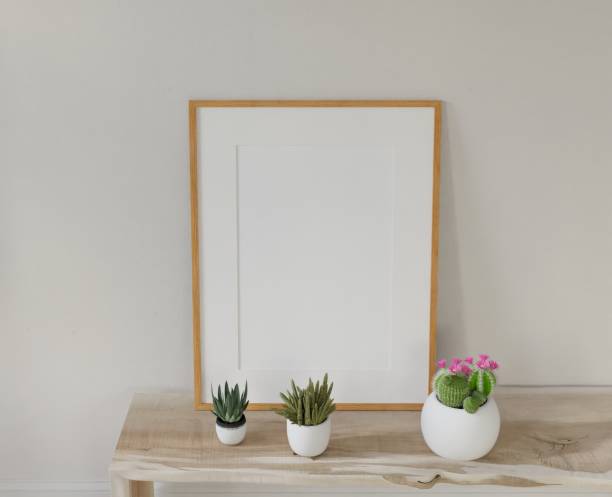 istock Frame interior, mockup frame, poster wood frame on the table in empty picture living room interior vertical wooden floor There in illustration 3d rendering. 2037866315