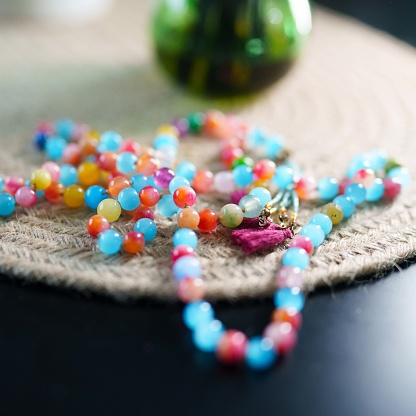 Close up to colorful gemstone bead necklace