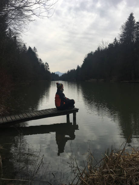 istock Silhouette of a man sitting on the dock 2037897559
