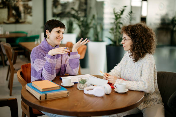 Young women taking a break in coffee bar