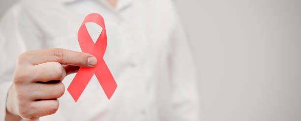 istock Man holding cancer awareness ribbon 2037924988