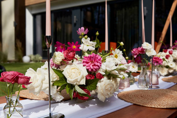 istock Outdoor elegance with pink and white floral table setting. Summer event and romantic dining ideas. 2037925510