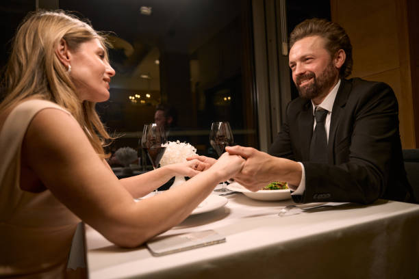 istock Couple sits at a table in a restaurant 2037927208