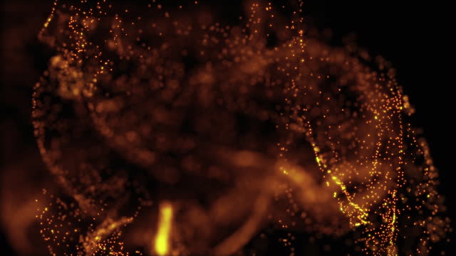 Luxury background of golden dust particles flowing in the liquid with slow motion and bokeh. Abstact elegant golden background. Gold particles fluid motion. Liquid motion, ink drops mixing in water.