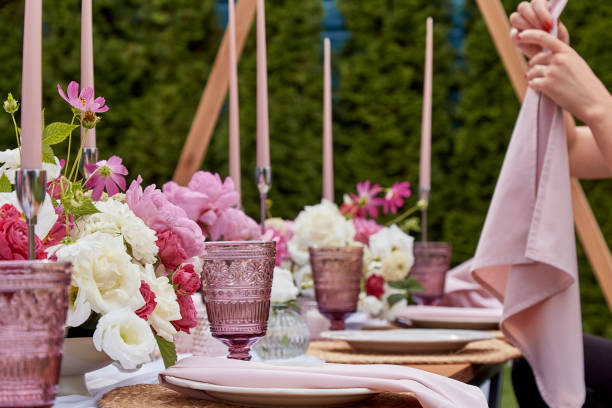 istock Picnic aesthetics table setting, flowers arrangement. Decorating table with white and pink blooms. Visuals home entertaining and floral arrangement. 2037931052