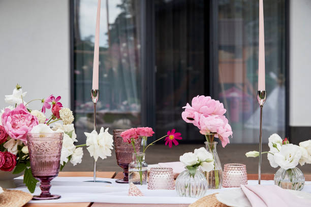 istock Outside aesthetic festive table setting, flowers arrangement 2037936482