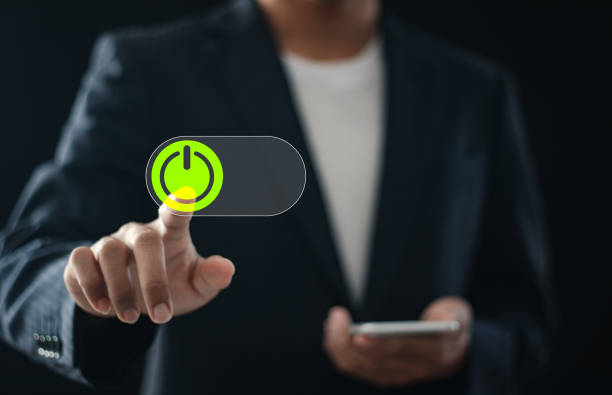 istock Businessman pressing power button on virtual screen for start or shut down concept. 2037951026