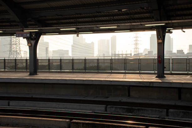 Bangkok, Thailand - October 14, 2023: Train station is called MRT or Metropolitan Rapid Transi is public transportation in capital Bangkok on city landscape and buildings covered with dust background.