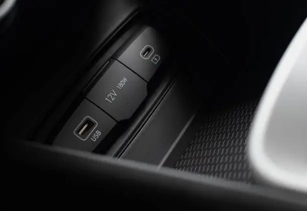 Photo of Interior socket block, USB, 12V, 180W of passenger car close-up