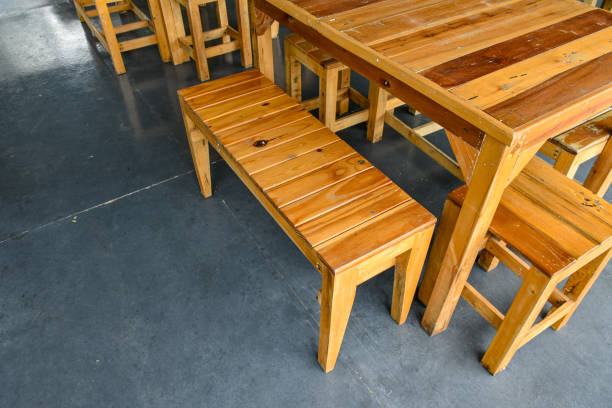 istock Beautiful patterned wooden table and chairs on a gray concrete background at the kitchen for restaurant design ideas or dining decorations. 2037974799