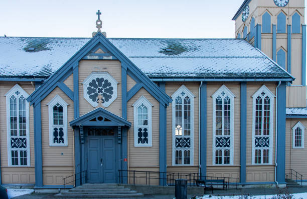 side view of the lutheran cathedral, called "church of norway" at tromso city, norway. - scandinavian church front view norway imagens e fotografias de stock