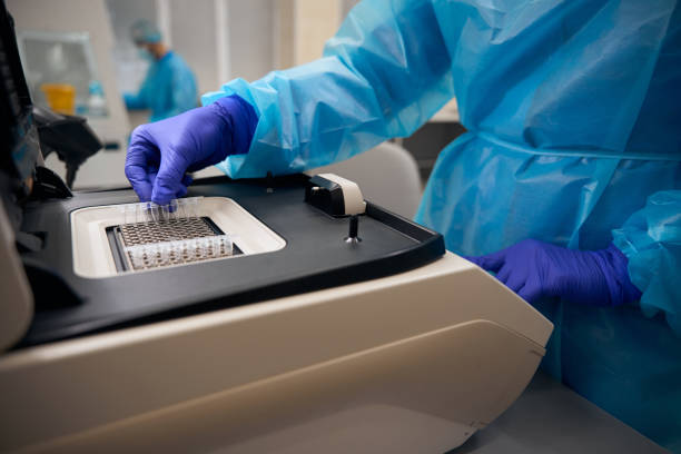 istock Virologist laboratory technician uses a special apparatus to study biomaterial 2037985660
