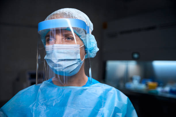 istock Specialist in a modern laboratory in protective equipment 2037985692
