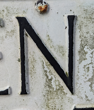 A Written Wording in Distressed State Typography Found Number Letter