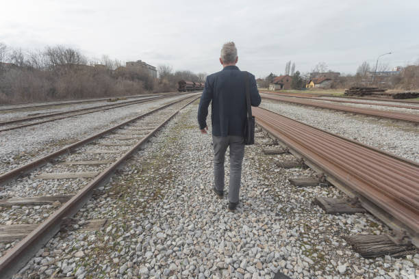 Man is walking to his work place because public transport nor working