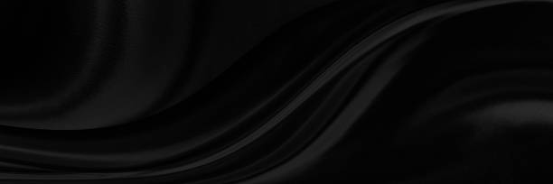 istock Black gray satin dark fabric texture luxurious shiny that is abstract silk cloth background with patterns soft waves blur beautiful. 2038088098