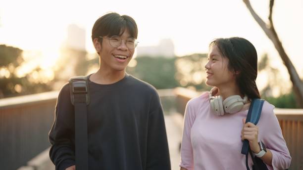 istock Two teenage relax walking in the park. 2038094935