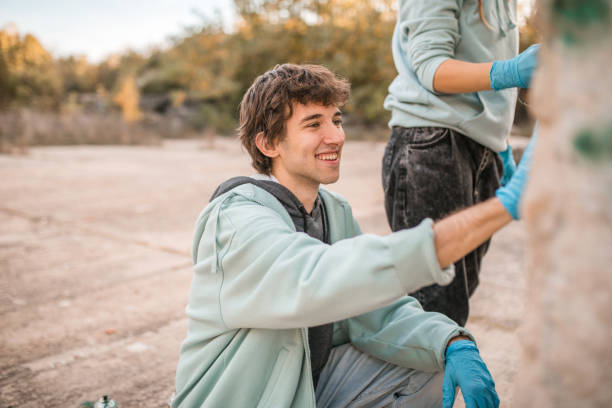 istock A smiling artist enjoys drawing graffiti with his friend 2038102562