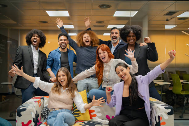 istock Team celebrates success with joyous gestures. 2038120944