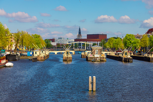 View of the canal with boats and beautiful buildings of Vlaardingen (Rotterdam, Netherlands, Holland)