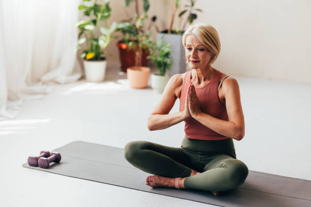 istock Senior Woman Practicing Yoga in Serene Indoor Environment 2038148986