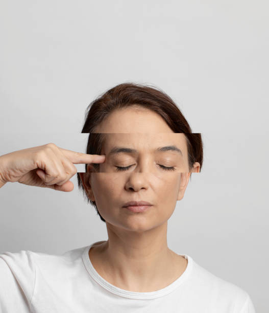 Burnout Woman touching her head with finger and shifted her eye part to the side. Mental health and burnout concept. pain points stock pictures, royalty-free photos & images