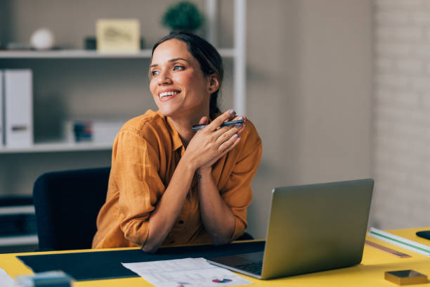 istock Happy Businesswoman Enjoying Success at Work in Office Setting 2038157659