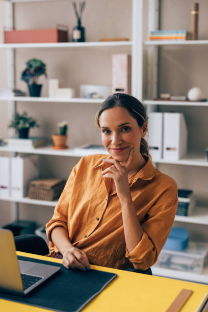 istock Professional Woman Smiling at Camera in a Home Office Setting 2038157665