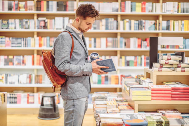 Young man shopping books