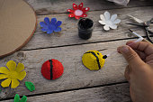 Step by step instructin. DIY flowers and lady bug from recycling egg boxes. Zero waste concept.