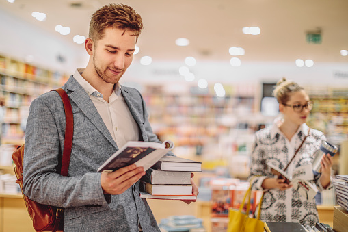 Young couple shopping books