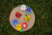 DIY flowers and lady bug from recycling egg boxes. Zero waste concept.