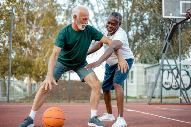 istock Two Diverse Senior Friends Playing Basketball 2038167001