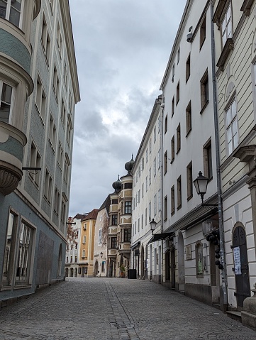 Linz, Austria – February 11, 2024: An urban street with closely spaced buildings and tall windows in Linz, Austria
