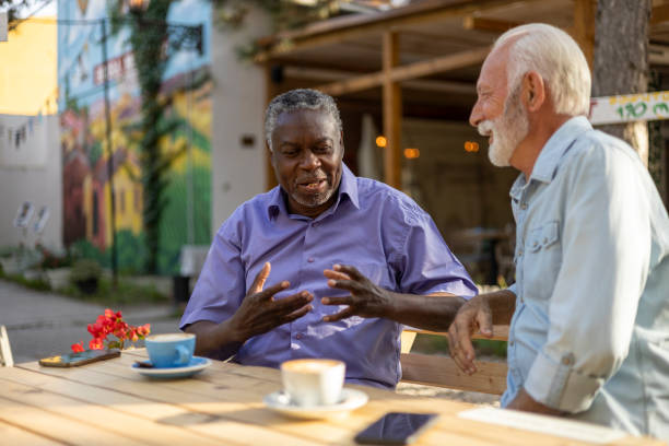 istock Two Diverse Senior Male Friends Interacting 2038168057