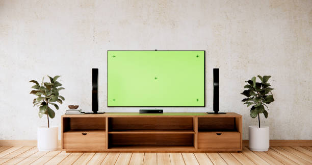 istock Smart Tv Mockup with blank green screen hanging in modern white empty room interior minimal designs. 2038172477
