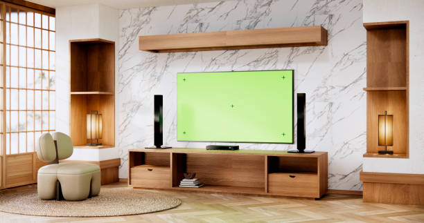 istock Smart Tv Mockup with blank green screen hanging in modern white empty room interior minimal designs. 2038173045