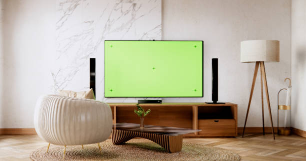 istock Smart Tv Mockup with blank green screen hanging in modern white empty room interior minimal designs. 2038174151