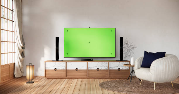 istock Smart Tv Mockup with blank green screen hanging in modern white empty room interior minimal designs. 2038174708