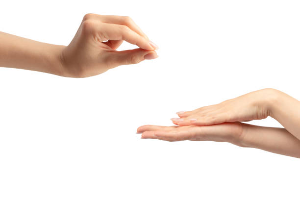 istock Hand of a woman holds some tiny or thin object. 2038204315